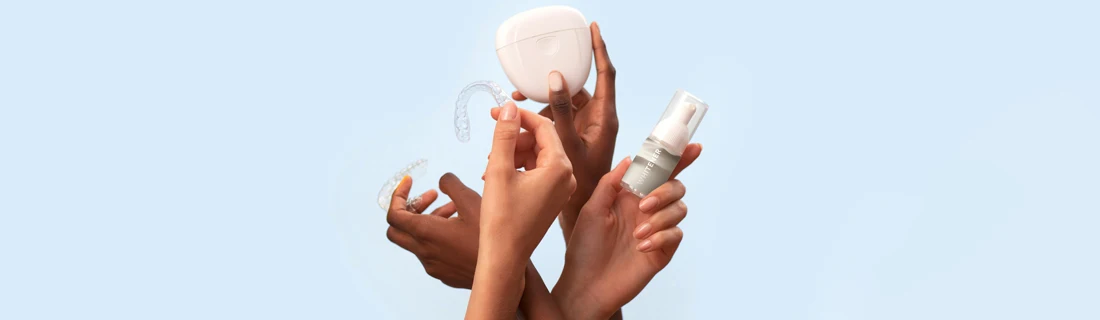 Dentist Northridge CA Cosmetic (2) Four hands holding various cosmetic dentistry products.